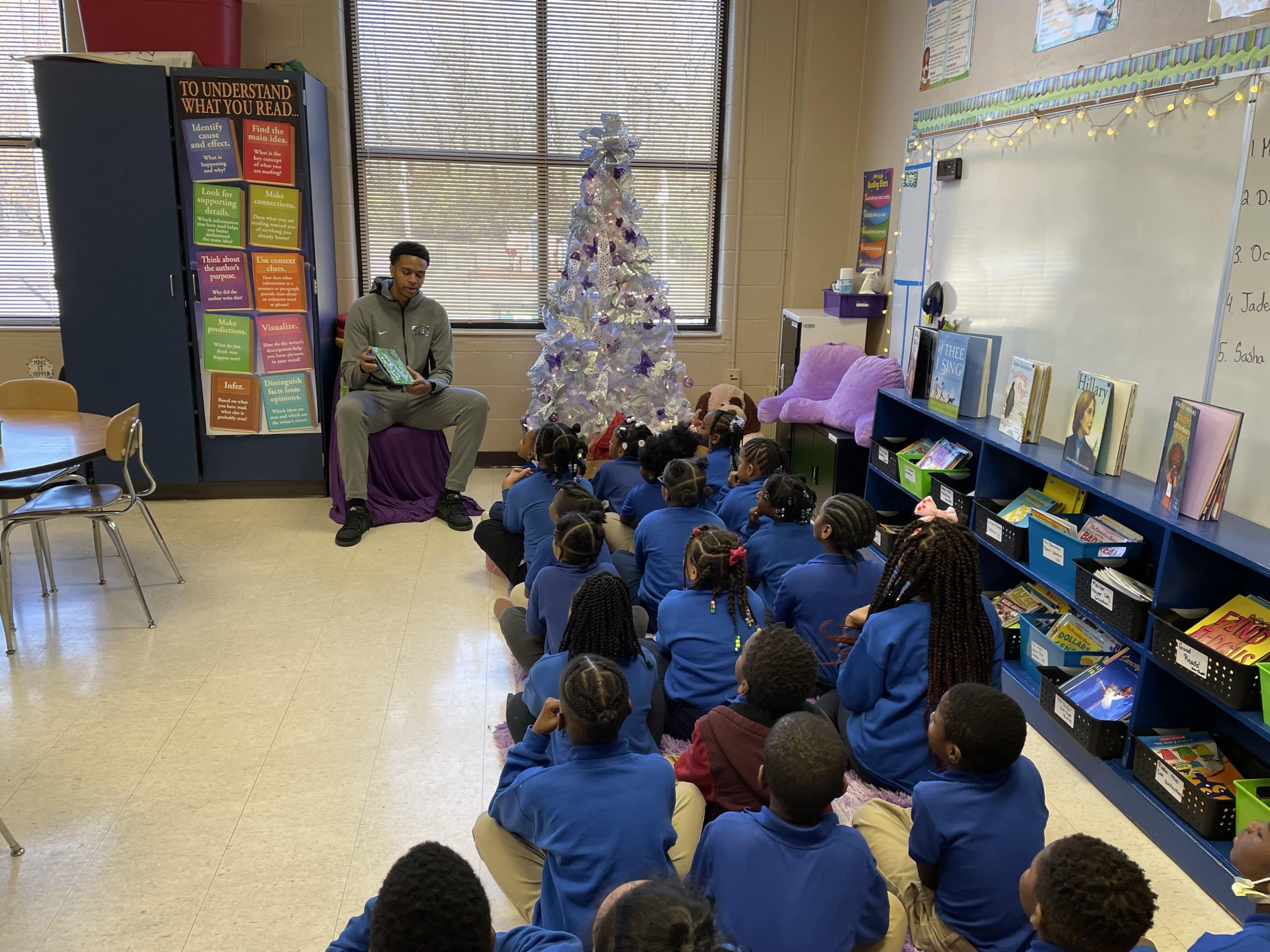 Featured image for “Memphis forward Ashton Hardaway reads to second-grade students.”
